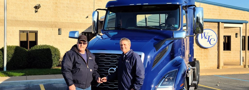 Trucking Company, Driver Owner handing keys to driver